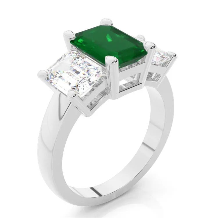 1 Carat Emerald Cut Lab Created Emerald and Moissanite Three Stone Engagement Ring in 18 Karat Gold - Boutique Pavè