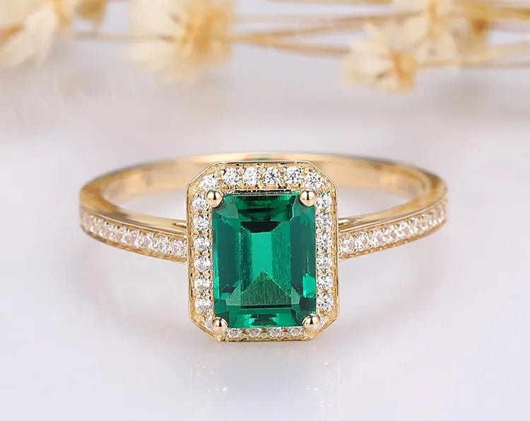 1.25 Carat Emerald Cut Lab Created Emerald and Moissanite Halo Engagement Ring in 14 Karat Gold - Boutique Pavè