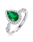 1.5 Carat Pear Cut Emerald Cut Lab Created Emerald and Moissanite Halo Engagement Ring in 14 Karat White Gold - Boutique Pavè