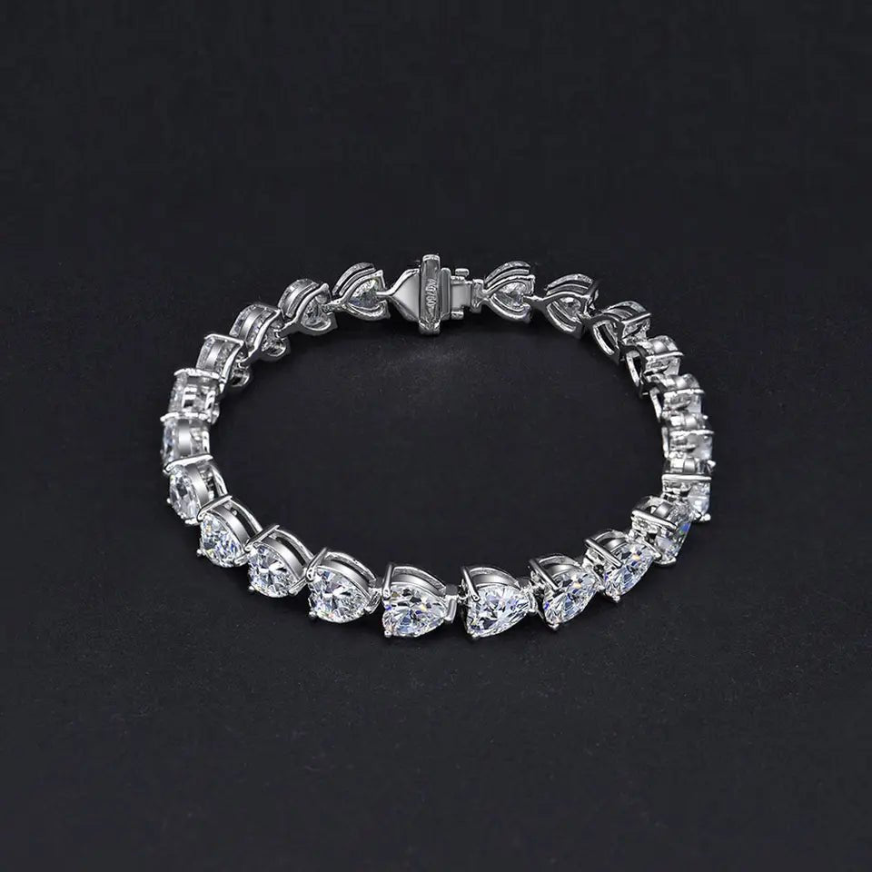 22 Carat Heart Cut Cubic Zirconia Statement Tennis Bracelet in Platinum-Plated Sterling Silver - Boutique Pavè