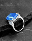 25 Carat Emerald Cut Fancy Blue Cubic Zirconia Statement Ring in Platinum Plated Sterling Silver - Boutique Pavè