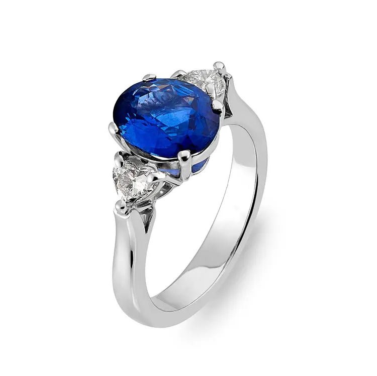 2.5 Carat Oval Cut Lab Created Sapphire and Moissanite Accent Solitaire Engagement Ring in 14 Karat White Gold - Boutique Pavè