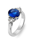 2.5 Carat Oval Cut Lab Created Sapphire and Moissanite Accent Solitaire Engagement Ring in 14 Karat White Gold - Boutique Pavè