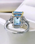 3 Carat Emerald Cut Fancy Blue Lab Created Diamond Solitaire Accent Engagement Ring in 18 Karat Gold - Boutique Pavè