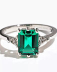 3 Carat Emerald Cut Lab Created Emerald Solitaire Accent Engagement Ring in 14 Karat White Gold - Boutique Pavè
