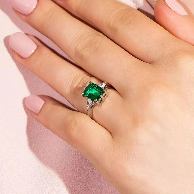 3 Carat Emerald Cut Lab Created Emerald Solitaire Accent Engagement Ring in 14 Karat White Gold - Boutique Pavè