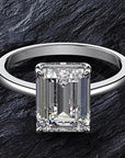 4 Carat Emerald Cut 5A Rated Cubic Zirconia Solitaire Engagement Ring in Platinum Plated Sterling Silver - Boutique Pavè