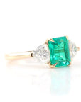 4 Carat Emerald Cut Lab Created Emerald and Trillion Cut Moissanite Accent Engagement Ring in 14 Karat Yellow Gold - Boutique Pavè