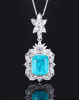 6 Carat Emerald Cut Imitation Blue Topaz and Cubic Zirconia Celebrity Inspired Necklace and Earring Set in Platinum Plated Sterling Silver - Boutique Pavè