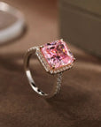 6.5 Carat Radiant Cut Fancy Pink Cubic Zirconia Halo Engagement Ring in Platinum Plated Sterling Silver - Boutique Pavè