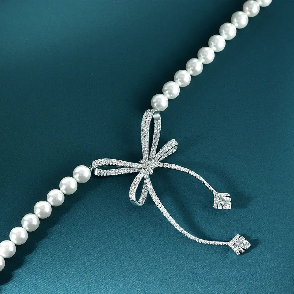 Faux Pearl and Round Cut Cubic Zirconia Bow Bridal Necklace in Platinum-Plated Sterling Silver - Boutique Pavè