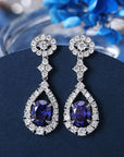 Four Carat Oval Cut Imitation Tanzanite and Cubic Zirconia Statement Earrings in Platinum-Plated Sterling Silver - Boutique Pavè
