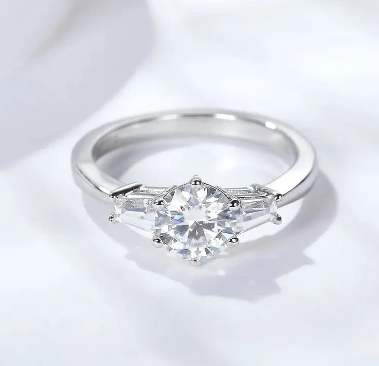 One Carat Brilliant Round Cut Moissanite Accent Solitaire Engagement Ring in Platinum Plated Sterling Silver - Boutique Pavè