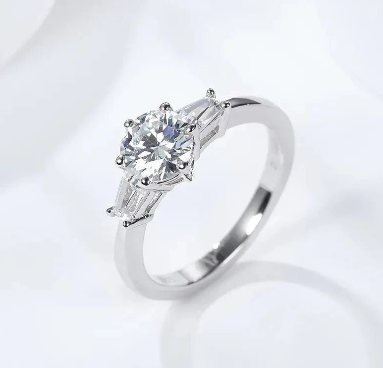 One Carat Brilliant Round Cut Moissanite Accent Solitaire Engagement Ring in Platinum Plated Sterling Silver - Boutique Pavè