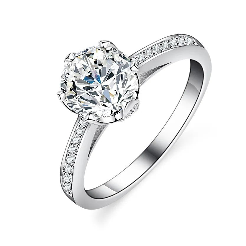 One Carat Brilliant Round Cut Moissanite Bridge Accent Solitaire Engagement Ring in Platinum Plated Sterling Silver - Boutique Pavè