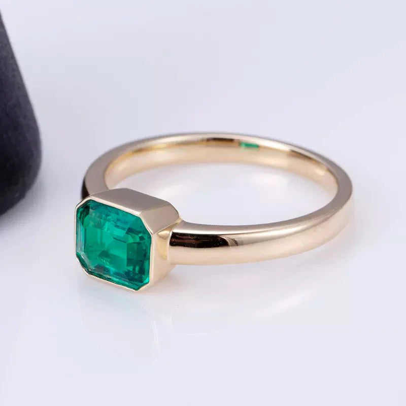 One Carat Emerald Cut Lab Created Emerald Gemstone Tension Set Ring in 18 Karat Yellow Gold - Boutique Pavè