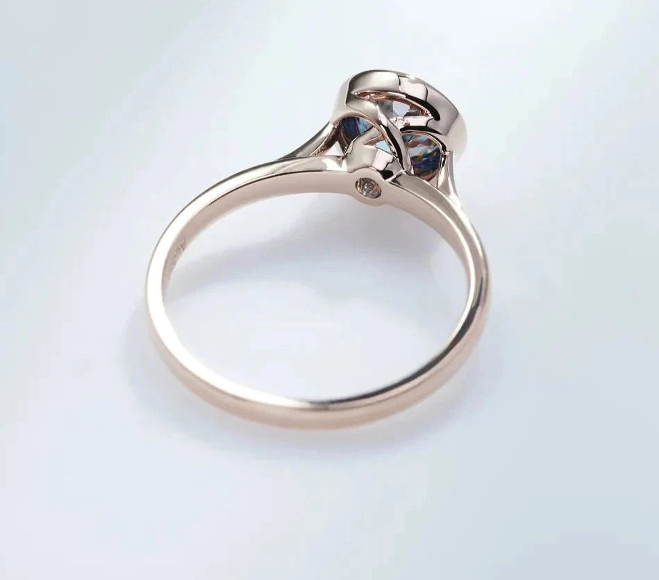 One Carat Portuguese Round Cut Vivid Blue Moissanite Bezel Set Engagement Ring in 18 Karat Rose Gold - Boutique Pave