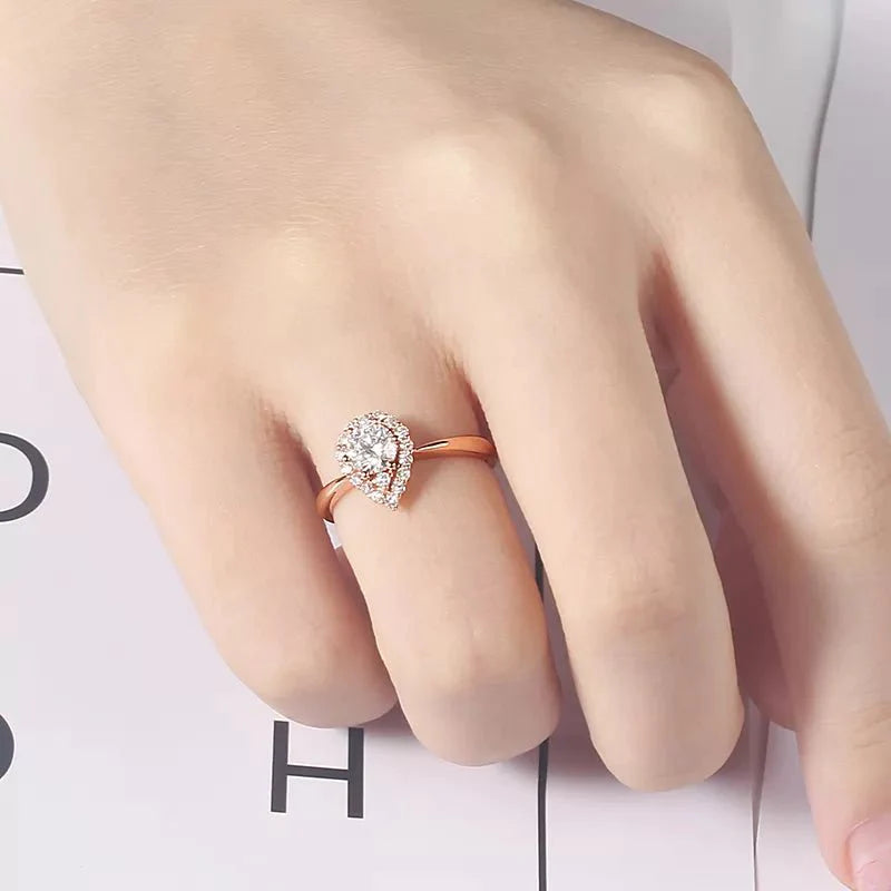 One Half Carat Pear Cut Lab Created Diamond Halo Engagement Ring in 18 Karat Rose Gold - Boutique Pavè