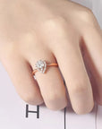 One Half Carat Pear Cut Lab Created Diamond Halo Engagement Ring in 18 Karat Rose Gold - Boutique Pavè