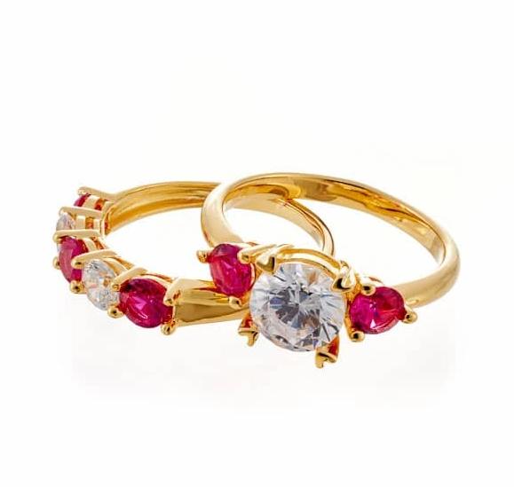 Round and Ruby Accent Three Stone Cubic Zirconia Bridal Ring Set In Yellow Gold Plated Sterling Silver - Boutique Pavè