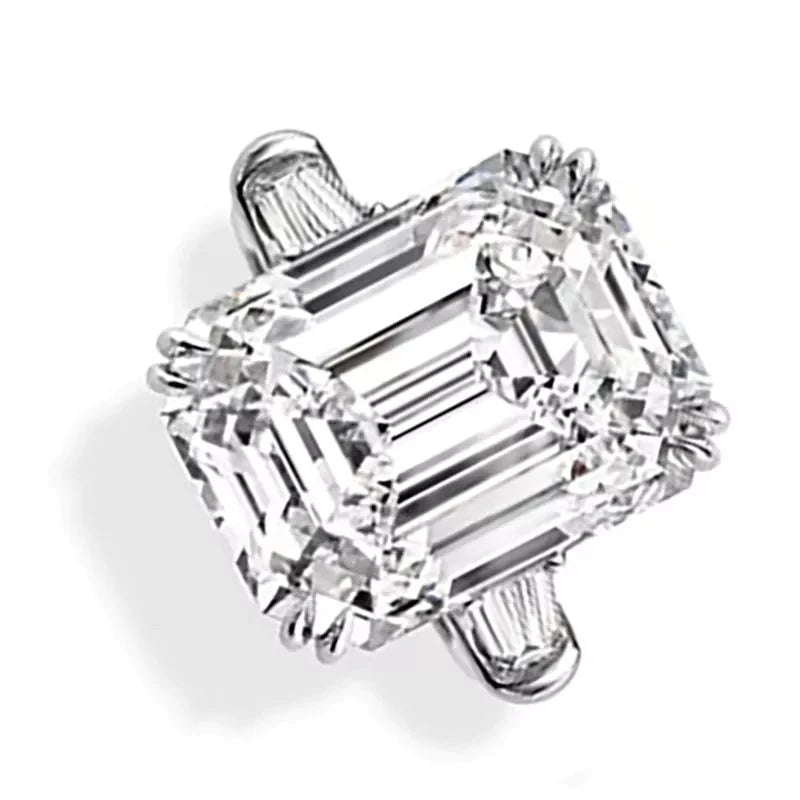 Ten Carat Emerald Cut Moissanite and Baguette Engagement Ring in 18 Karat White Gold - Boutique Pavè