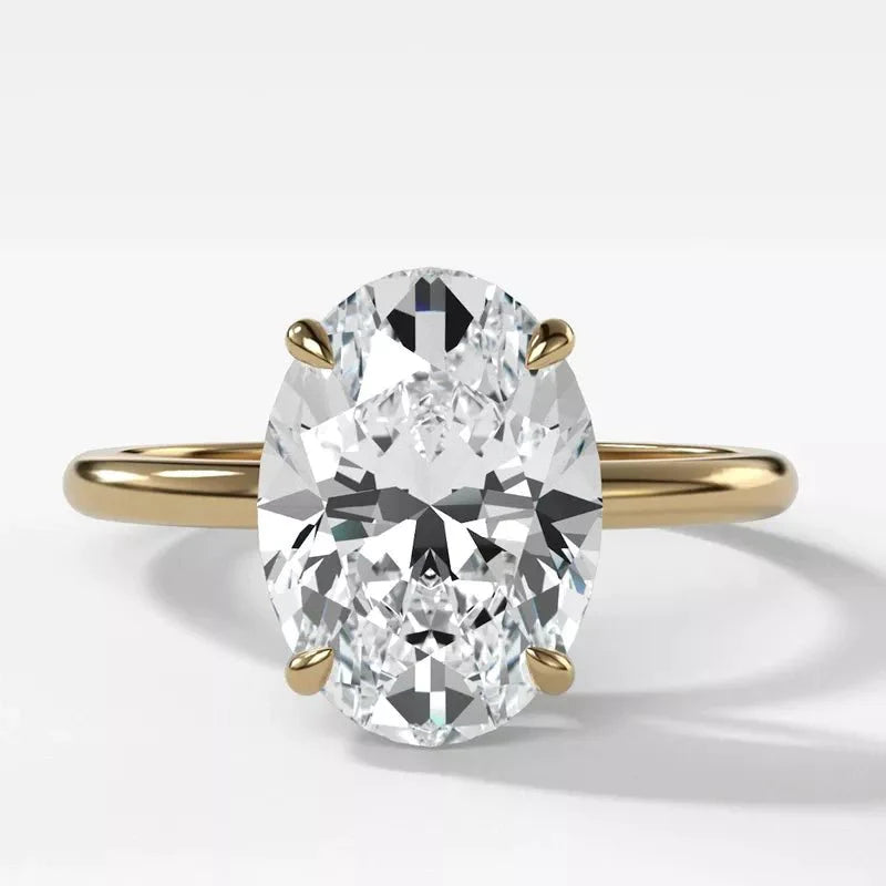 Three Carat Brilliant Oval Cut Moissanite Solitaire Engagement Ring in 14 Karat Yellow Gold - Boutique Pavè