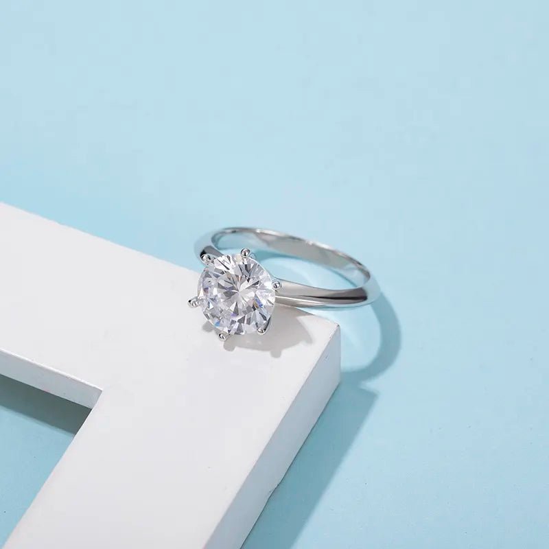 Three Carat Brilliant Round Cut Moissanite Solitaire Knife Edge Engagement Ring in Platinum Plated Sterling Silver - Boutique Pavè