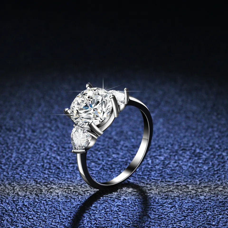 Three Carat Round and Heart Cut Moissanite Accent Solitaire Engagement Ring in Platinum Plated Sterling Silver - Boutique Pavè