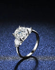 Three Carat Round and Heart Cut Moissanite Accent Solitaire Engagement Ring in Platinum Plated Sterling Silver - Boutique Pavè