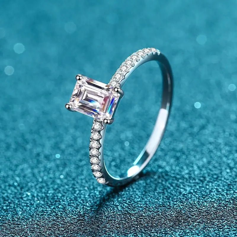 Two Carat Brilliant Emerald Cut Moissanite Pave Solitaire Engagement Ring in Platinum Plated Sterling Silver - Boutique Pavè