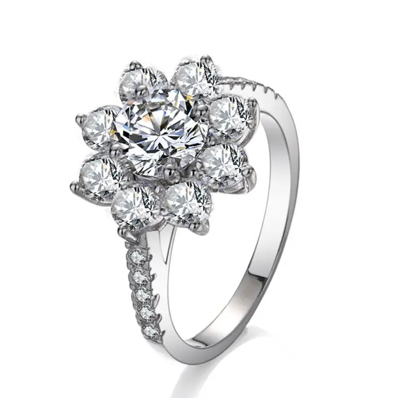 Two Carat Brilliant Round Cut Moissanite Sunflower Halo Engagement Ring in Platinum Plated Sterling Silver - Boutique Pavè