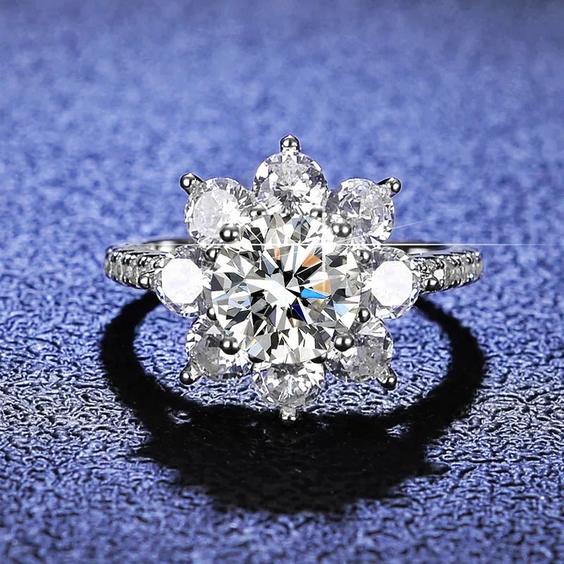 Two Carat Brilliant Round Cut Moissanite Sunflower Halo Engagement Ring in Platinum Plated Sterling Silver - Boutique Pavè