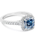 Two Carat Cushion Cut Blue Moissanite Halo Style Engagement Ring in 14 Karat White Gold - Boutique Pavè
