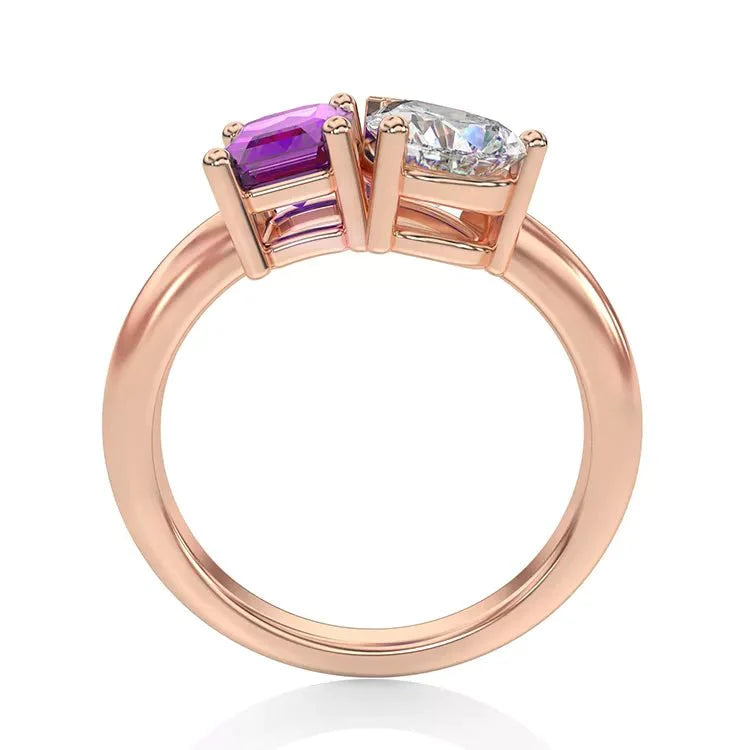 Two Carat Emerald and Pear Cut Moissanite and Lab Pink Sapphire Toi Et Moi Engagement Ring in 14 Karat Rose Gold - Boutique Pavè