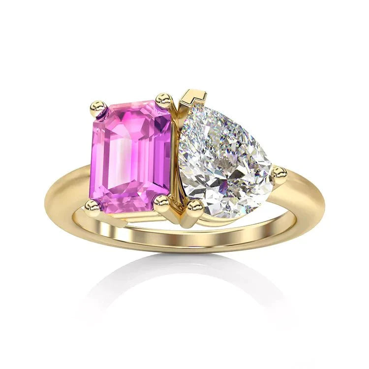Two Carat Emerald and Pear Cut Moissanite and Lab Pink Sapphire Toi Et Moi Engagement Ring in 14 Karat Yellow Gold - Boutique Pavè