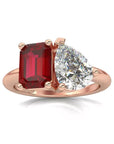 Two Carat Emerald and Pear Cut Moissanite and Lab Ruby Toi Et Moi Engagement Ring in 14 Karat Rose Gold - Boutique Pavè