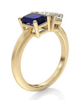 Two Carat Emerald Cut Lab Grown Blue Sapphire and Pear Cut White Moissanite Toi Et Moi Engagement Ring in 14 Karat Yellow Gold - Boutique Pavè