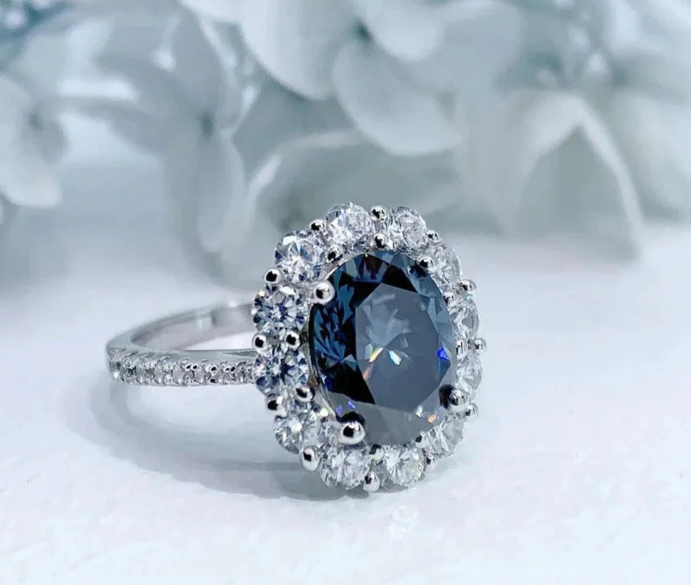 Two Carat Oval Cut Blue Moissanite Halo Engagement Ring in 18 Karat White Gold - Boutique Pave