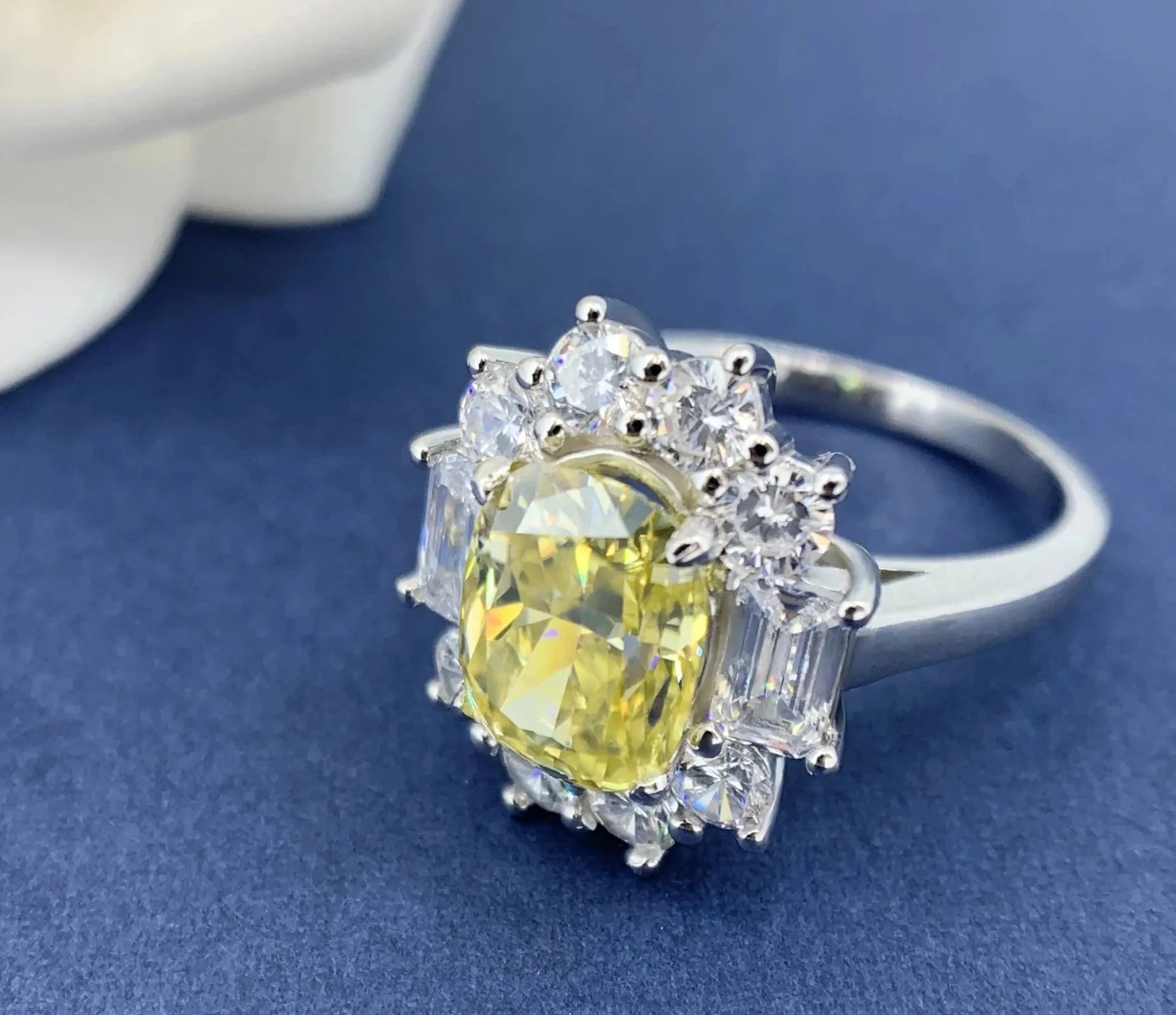 Two Carat Oval Cut Canary Yellow Moissanite Fancy Halo Engagement Ring in 18 Karat White Gold - Boutique Pave