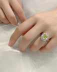 Two Carat Oval Cut Canary Yellow Moissanite Fancy Halo Engagement Ring in 18 Karat White Gold - Boutique Pave