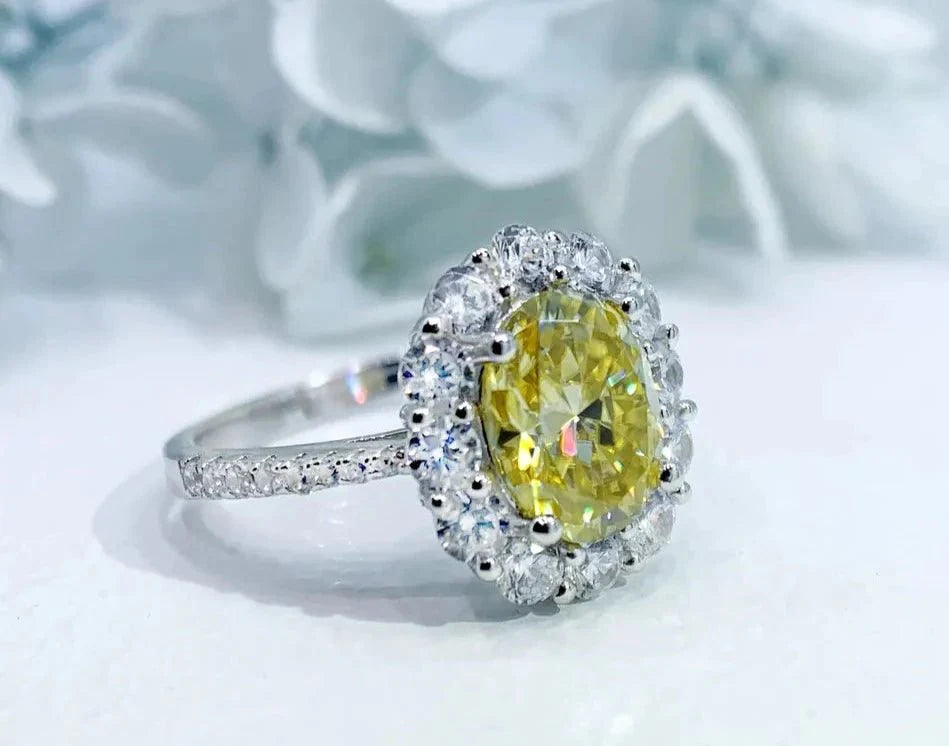 Two Carat Oval Cut Canary Yellow Moissanite Halo Engagement Ring in 18 Karat White Gold - Boutique Pave