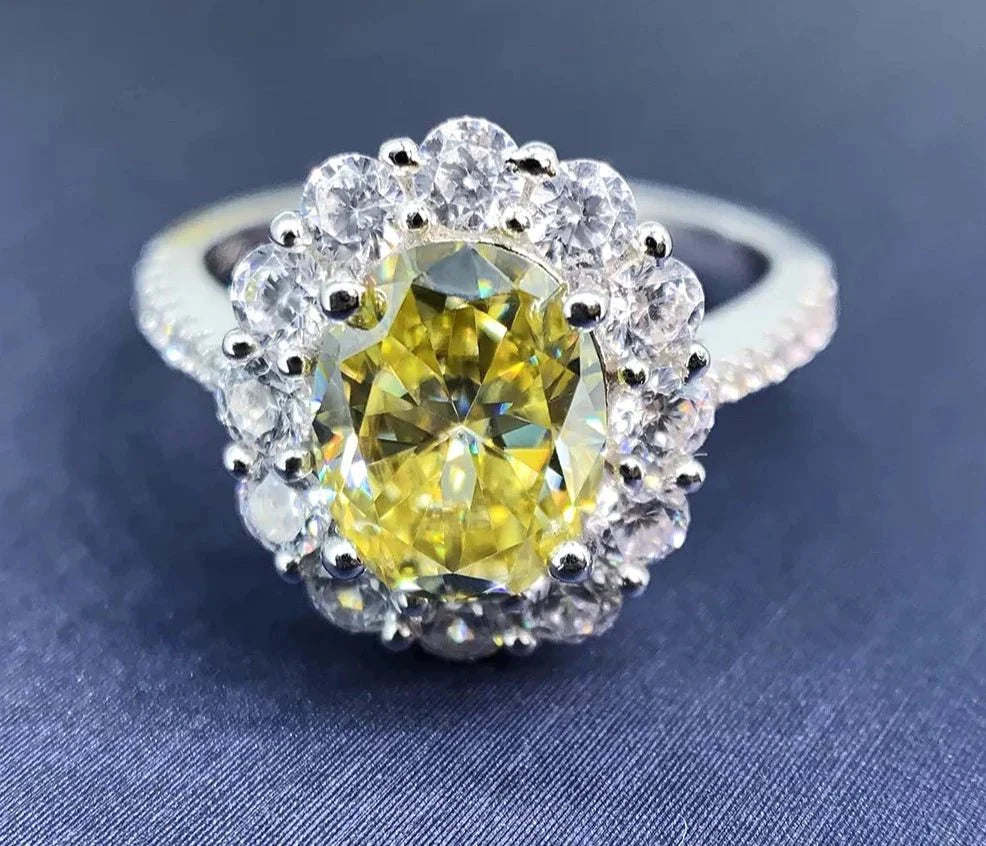 Two Carat Oval Cut Canary Yellow Moissanite Halo Engagement Ring in 18 Karat White Gold - Boutique Pave