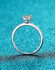 Two Carat Oval Cut Moissanite Pave Solitaire Engagement Ring in Platinum Plated Sterling Silver - Boutique Pavè